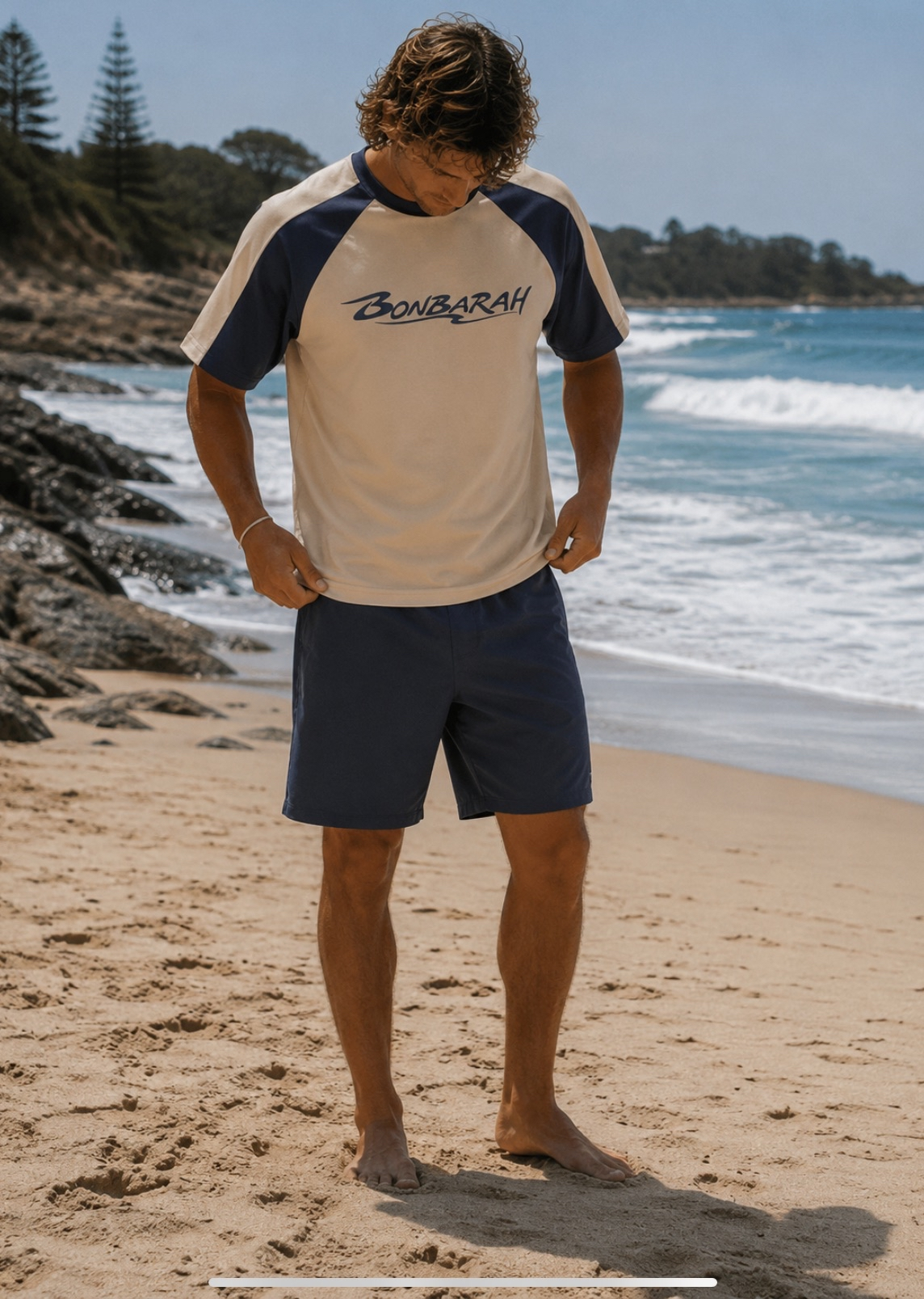 Breakwater Raglan Tee flat lay on wooden surface