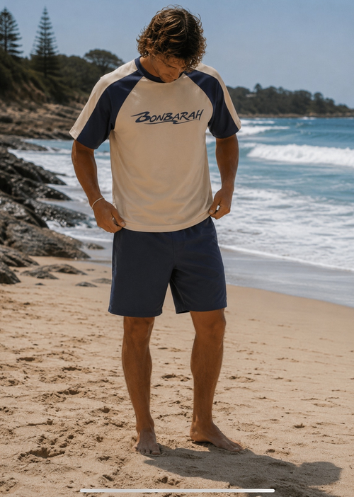 Breakwater Raglan Tee flat lay on wooden surface