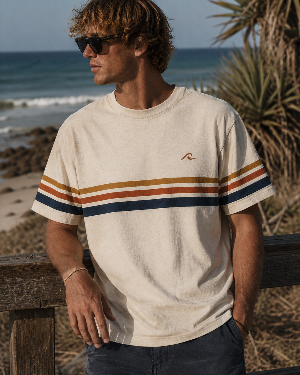 Coast Stripe Tee worn at the beach showing retro stripe detail