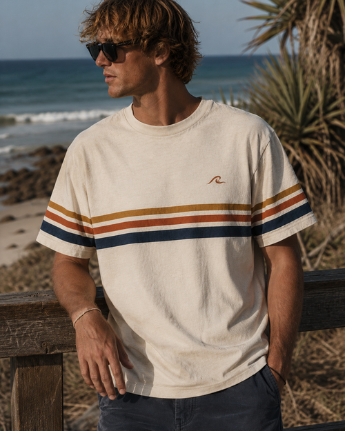 Coast Stripe Tee worn at the beach showing retro stripe detail